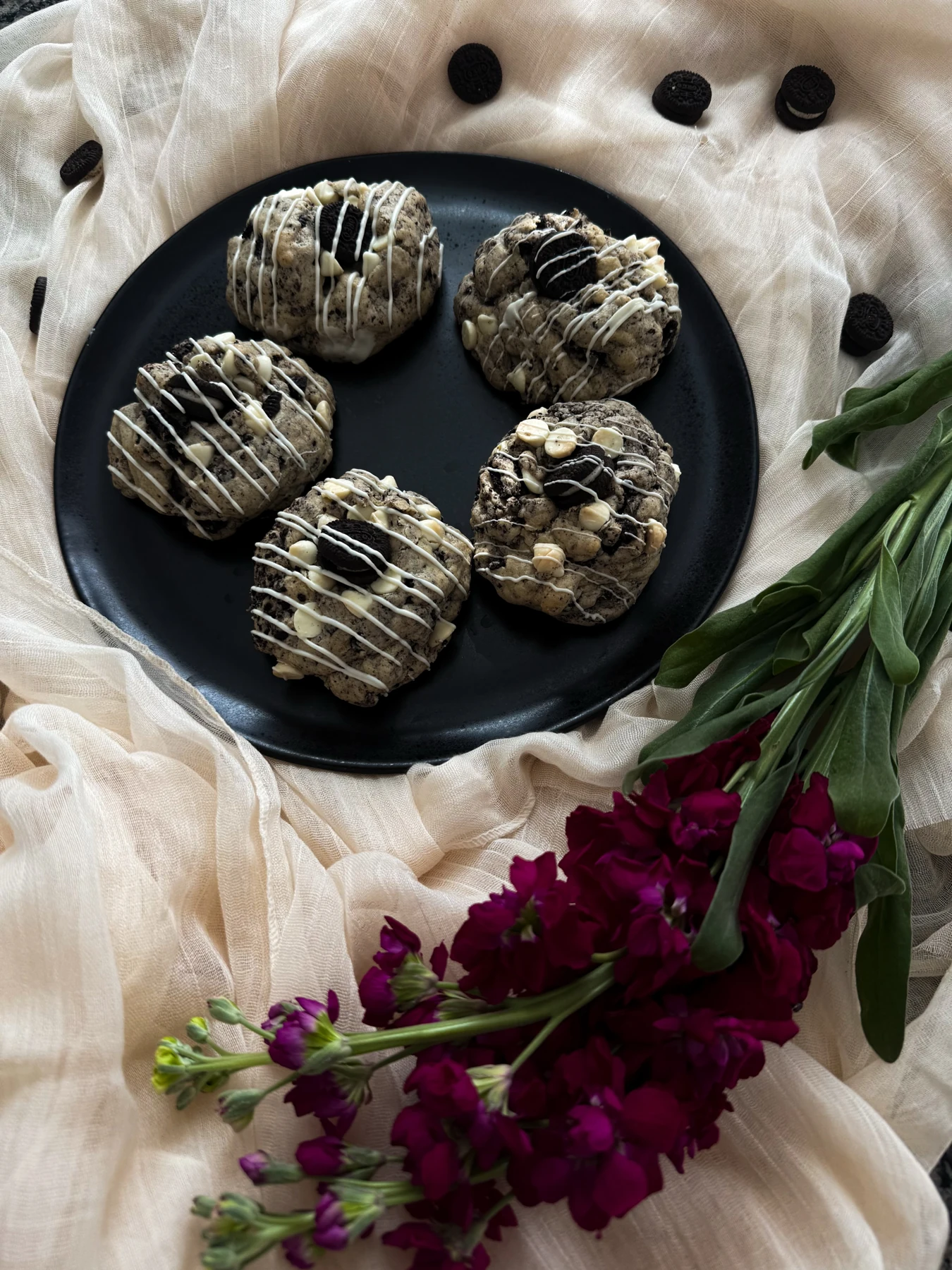 Oreo cookies with mini Oreos and white chocolate drizzle