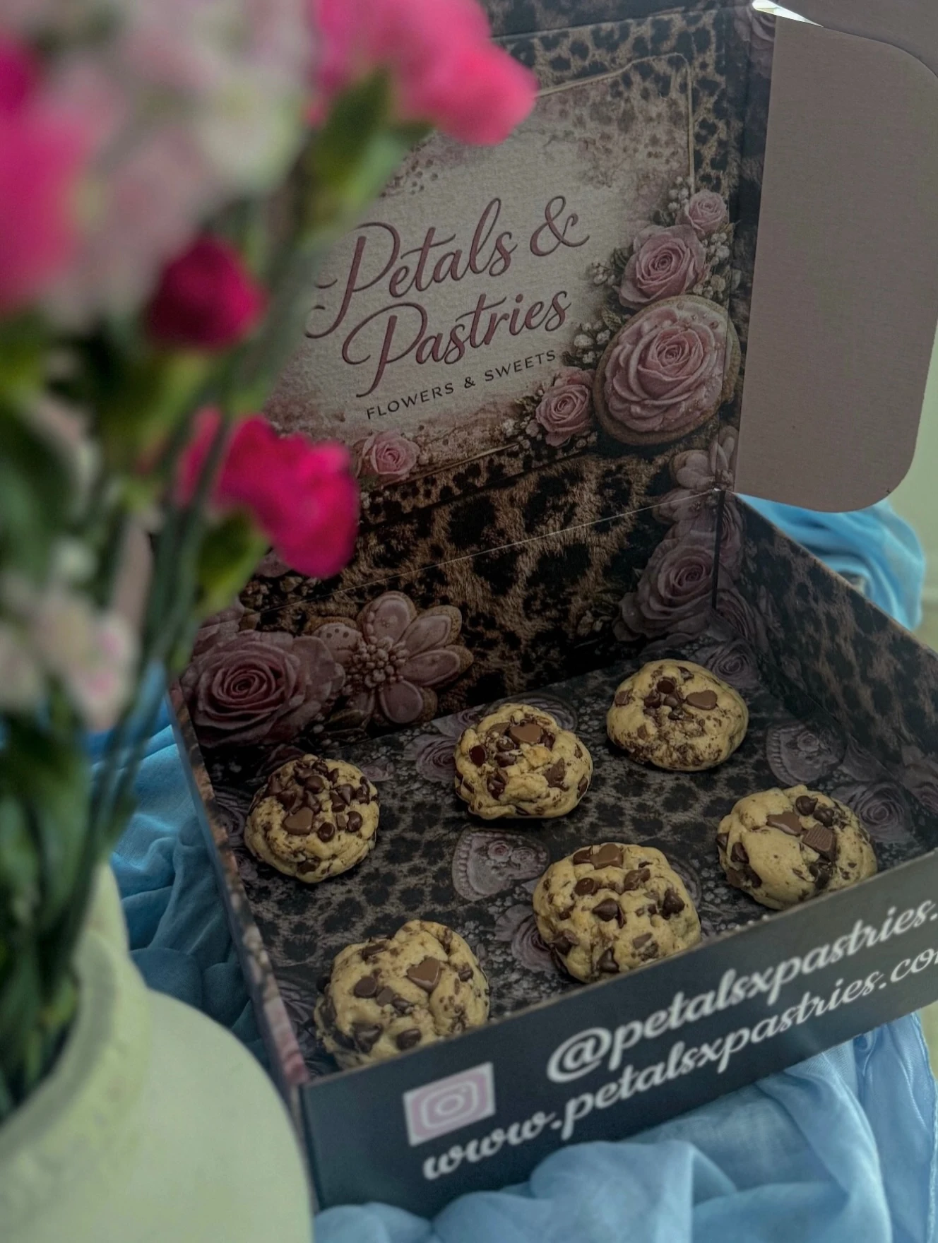 Chunky chocolate chip cookies in a branded gift box